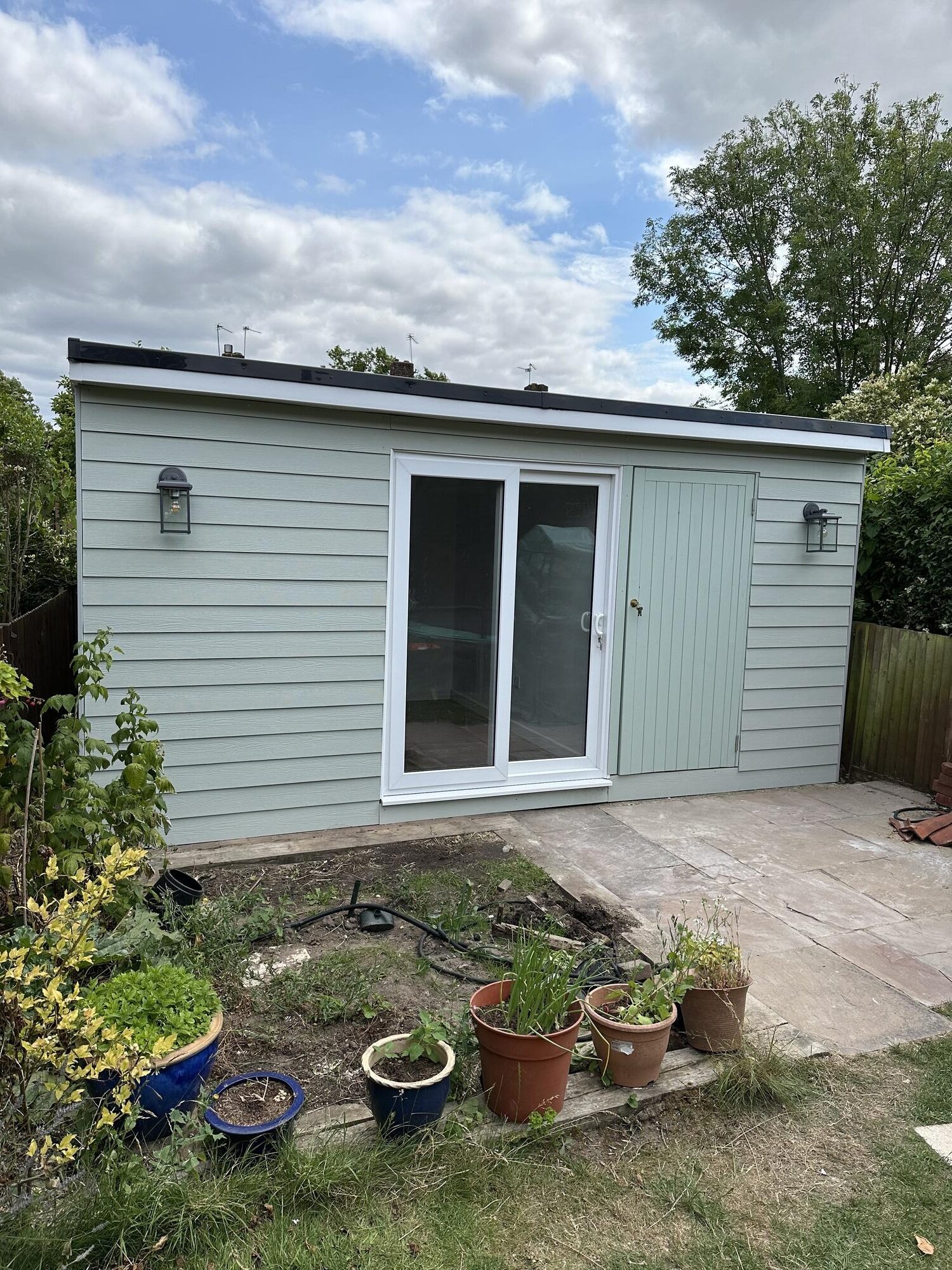 Comparing Building Materials for Garden Rooms: Wood vs. Composite